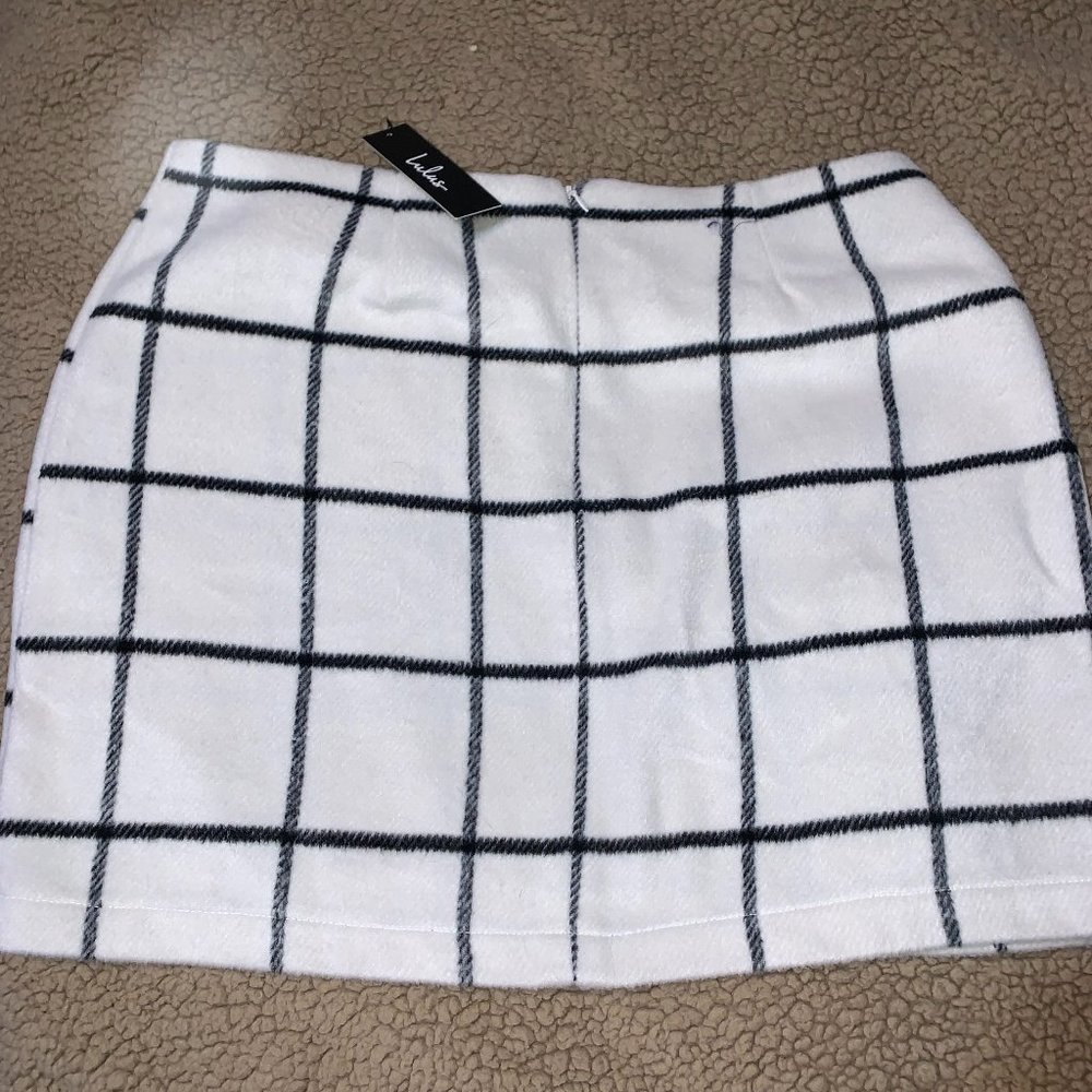White and black plaid skirt.